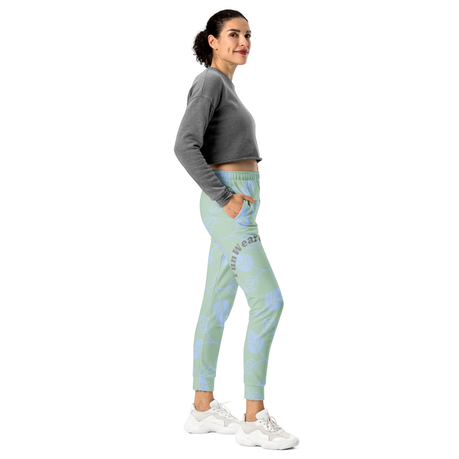Woman wearing a gray sweatshirt and light blue leggings with a pattern and 'Fun Wear Code' text logo on a white background