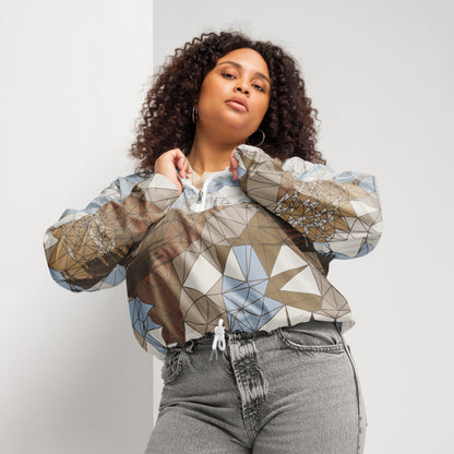 Woman wearing a geometric patterned jacket against a plain background