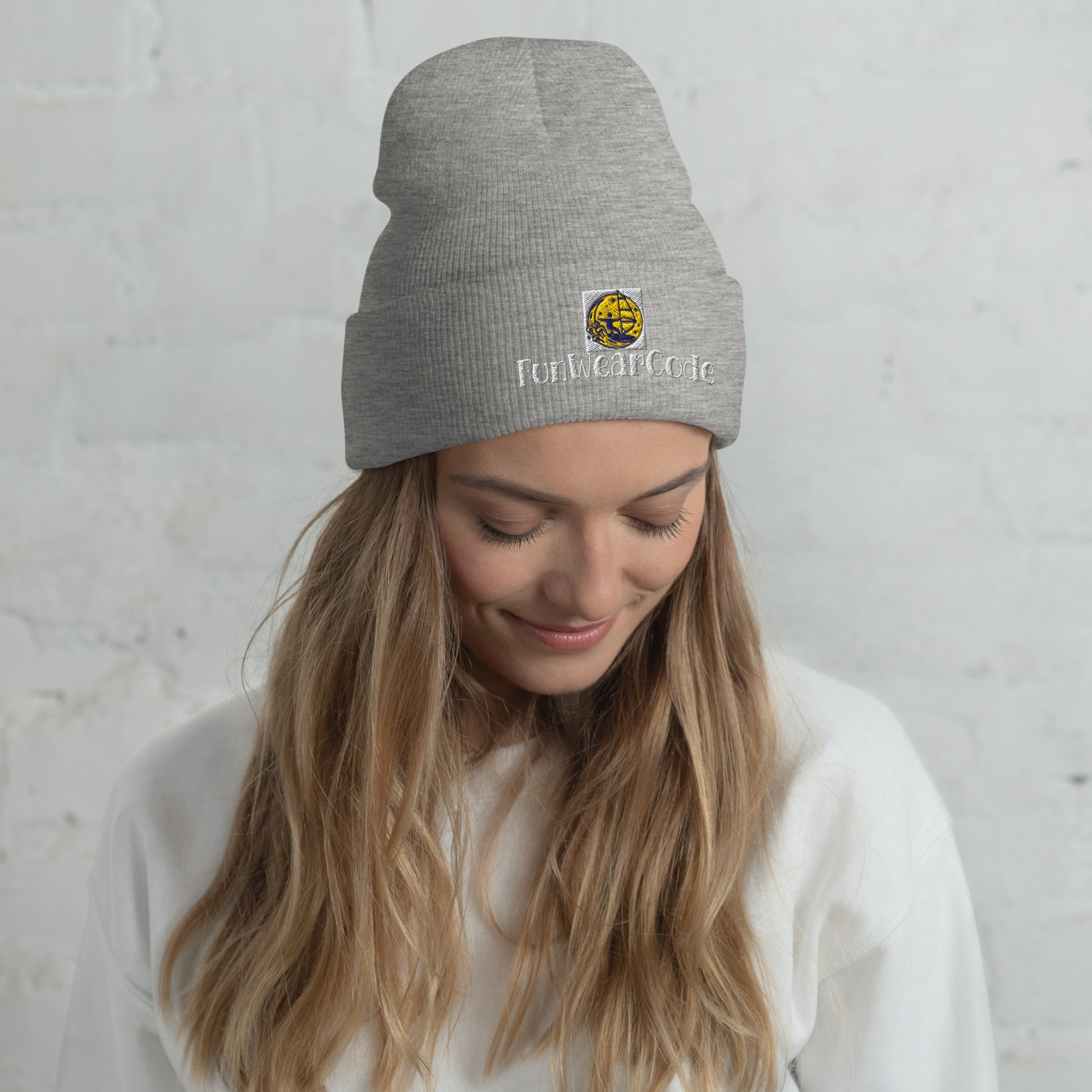 Woman wearing a gray beanie with 'Fun Wear Code' a logo and text against a light gray background