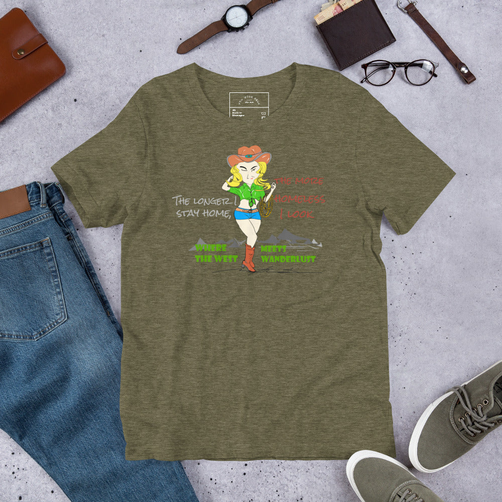 Green t-shirt with a cowgirl graphic design and fun quote on a concrete surface with jeans, shoes, and accessories.