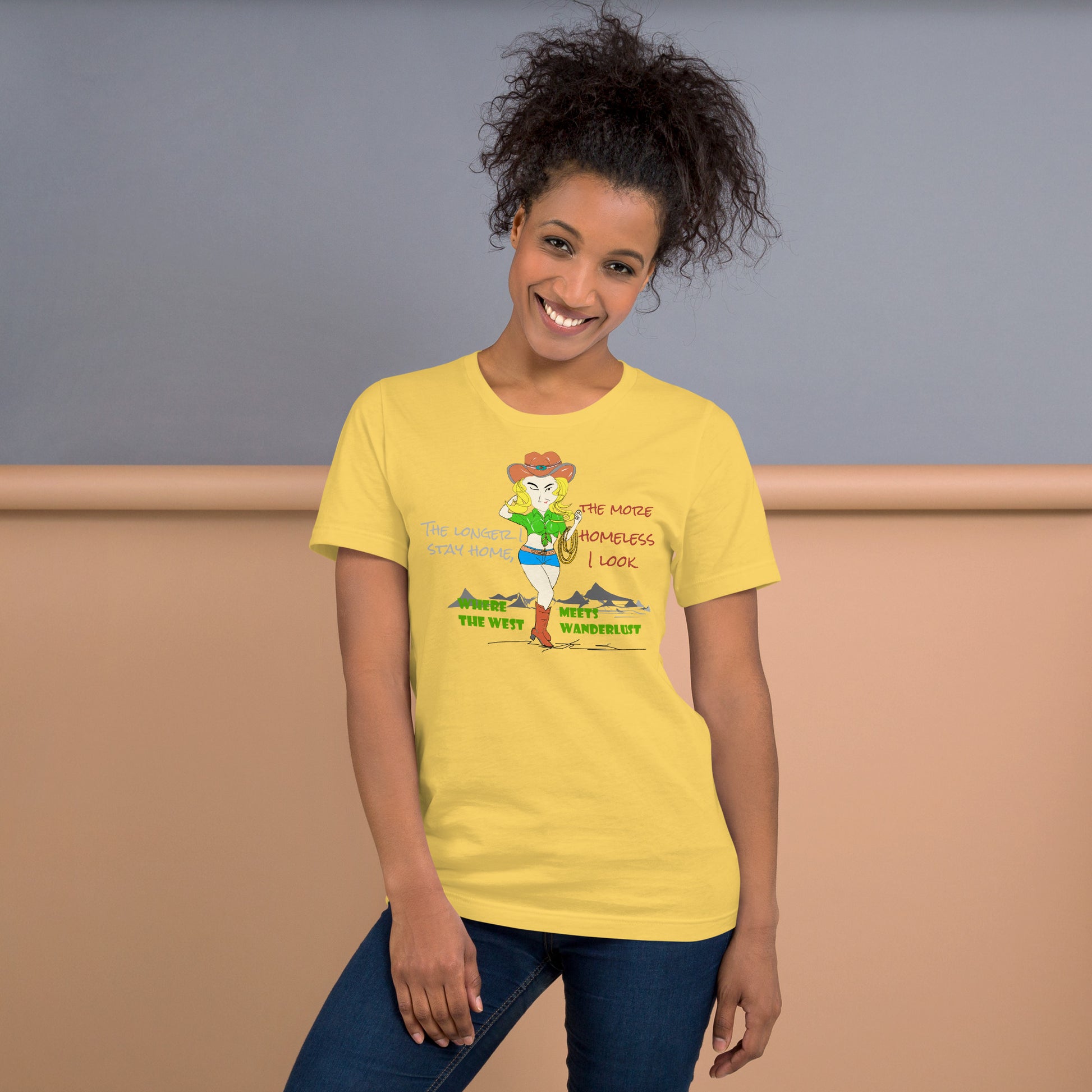 Woman wearing a yellow t-shirt with a cowgirl graphic design on a plain background